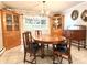 Traditional dining room featuring wooden furniture, including a large table and antique cabinets at 3158 Salisbury Hwy, Statesville, NC 28677