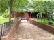 A charming home with a brick driveway, surrounded by lush greenery, providing a welcoming entrance at 3158 Salisbury Hwy, Statesville, NC 28677