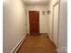 An inviting entryway with hardwood floors, a classic wooden door, and neutral walls at 3158 Salisbury Hwy, Statesville, NC 28677