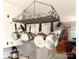Charming kitchen decor with a pot rack hanging above the center island at 3158 Salisbury Hwy, Statesville, NC 28677