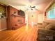 Inviting living room featuring a red brick fireplace with mantel, hardwood floors and recessed lighting at 3158 Salisbury Hwy, Statesville, NC 28677