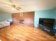 Bright living room features a brick fireplace and comfortable seating, offering a cozy space for gatherings at 3158 Salisbury Hwy, Statesville, NC 28677