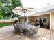 A large deck is furnished with an outdoor dining set, perfect for entertaining in the expansive backyard at 3347 Xandra Ct, Indian Land, SC 29707