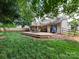 Spacious backyard boasts a well-maintained lawn and a two-tiered deck, great for outdoor entertaining at 3347 Xandra Ct, Indian Land, SC 29707
