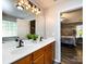 Bathroom with double vanity, modern fixtures, and a view into the bedroom at 3347 Xandra Ct, Indian Land, SC 29707