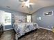 Bright bedroom with wood floors, vaulted ceilings, and rustic wood headboard at 3347 Xandra Ct, Indian Land, SC 29707