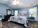 Charming bedroom with wood floors, vaulted ceilings, and stylish decor at 3347 Xandra Ct, Indian Land, SC 29707