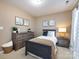 Neutral bedroom with bed, dresser, and decor at 3347 Xandra Ct, Indian Land, SC 29707