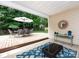 A covered patio with comfortable seating and a dining area that offers relaxing outdoor living space at 3347 Xandra Ct, Indian Land, SC 29707