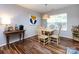 Bright dining area features natural light and wood flooring at 3347 Xandra Ct, Indian Land, SC 29707