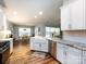 Open-concept kitchen with granite counters, stainless appliances, and an adjacent dining area at 3347 Xandra Ct, Indian Land, SC 29707