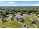Panoramic aerial view of Rob Wallace Park featuring a scenic pond, walking paths, and wooded areas at 3419 Brickyard Ln, Midland, NC 28107
