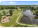 Scenic aerial view of Rob Wallace Park, showcasing a playground, picnic areas, and lakeside docks at 3419 Brickyard Ln, Midland, NC 28107