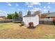 Backyard with a white storage shed, a trampoline, and a well-kept lawn, great for Gathering activities at 3419 Brickyard Ln, Midland, NC 28107
