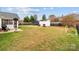 Spacious backyard with a well-maintained lawn, a storage shed, and recreational equipment at 3419 Brickyard Ln, Midland, NC 28107