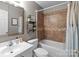 Modern bathroom with tiled shower/tub combination, vanity, and tasteful decor at 3419 Brickyard Ln, Midland, NC 28107
