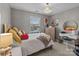 Comfortable bedroom with a window, decorative chandelier, vanity, and dresser, offering a cozy retreat at 3419 Brickyard Ln, Midland, NC 28107