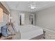 Bedroom featuring a neutral color scheme, tray ceiling, and easy access to the bathroom at 3419 Brickyard Ln, Midland, NC 28107