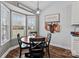 Bright dining area features a round wood table set, modern pendant light, and a view of the backyard at 3419 Brickyard Ln, Midland, NC 28107