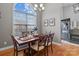Inviting dining room boasts hardwood floors, natural light from a large window, and stylish furnishings at 3419 Brickyard Ln, Midland, NC 28107