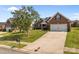 Traditional brick home with a well-kept lawn and a spacious driveway leading to an attached garage at 3419 Brickyard Ln, Midland, NC 28107