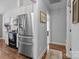 Kitchen features stainless steel refrigerator, modern appliances, and view into adjacent room at 3419 Brickyard Ln, Midland, NC 28107