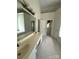 Spacious bathroom featuring double sinks, a large mirror, and a view of the tub at 390 Robinson Rd, Mooresville, NC 28117