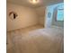 Neutral bedroom with carpet, window, and round accent mirror offering a peaceful retreat at 390 Robinson Rd, Mooresville, NC 28117