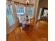 Cozy breakfast nook bathed in natural light, featuring a round table and classic wood chairs at 390 Robinson Rd, Mooresville, NC 28117