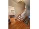 Bright entryway with hardwood floors and staircase leading to the upper level at 390 Robinson Rd, Mooresville, NC 28117
