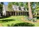 Delightful two-story home featuring a cozy front porch and a beautifully manicured lawn at 390 Robinson Rd, Mooresville, NC 28117