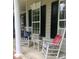 Inviting front porch with rocking chairs, perfect for enjoying the outdoors at 390 Robinson Rd, Mooresville, NC 28117