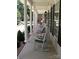 Inviting covered front porch with rocking chairs, offering a perfect spot to relax and enjoy the outdoors at 390 Robinson Rd, Mooresville, NC 28117