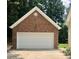 Detached two car garage made of brick with white doors at 390 Robinson Rd, Mooresville, NC 28117