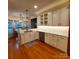 Spacious kitchen with a breakfast area, white cabinetry, and stainless steel appliances at 390 Robinson Rd, Mooresville, NC 28117