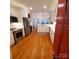 Bright kitchen featuring hardwood floors, stainless steel appliances, and a center island with a sink at 390 Robinson Rd, Mooresville, NC 28117