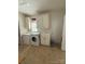 Well-organized laundry room with modern washer, dryer, utility sink, and ample storage at 390 Robinson Rd, Mooresville, NC 28117