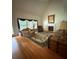 Bright living room with a cozy fireplace, hardwood floors, and large windows at 390 Robinson Rd, Mooresville, NC 28117