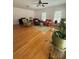 Spacious living room with hardwood flooring, comfortable seating, and stylish decor creating a cozy ambiance at 390 Robinson Rd, Mooresville, NC 28117