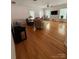 Expansive living room showcasing hardwood floors, ample natural light, ceiling fan and neutral color palette at 390 Robinson Rd, Mooresville, NC 28117