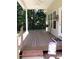 Inviting covered porch with ceiling fan and outdoor decor at 390 Robinson Rd, Mooresville, NC 28117