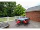 Inviting outdoor deck featuring a dining table and chairs with red cushions, perfect for entertaining in a serene setting at 400 Majolica Rd, Salisbury, NC 28147