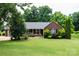 Charming brick ranch-style home featuring a well-manicured lawn and an inviting front porch at 400 Majolica Rd, Salisbury, NC 28147