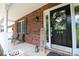 Charming front porch featuring a welcome sign, chairs, and brick accents at 400 Majolica Rd, Salisbury, NC 28147