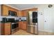 Well-equipped kitchen with stainless steel appliances and light wood cabinetry at 400 Majolica Rd, Salisbury, NC 28147