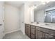 Bathroom featuring double sink vanity, quartz countertops, gray cabinets and a glass shower at 4012 Woodsmill Rd, Fort Mill, SC 29707