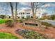 An image of the stately community club house with attractive landscaping and a brick entrance sign at 4012 Woodsmill Rd, Fort Mill, SC 29707
