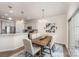 Cozy dining area adjacent to the kitchen with stylish lighting and sliding door access at 4012 Woodsmill Rd, Fort Mill, SC 29707