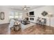 Comfortable living room featuring a modern fireplace, large sectional sofa, and stylish decor at 4012 Woodsmill Rd, Fort Mill, SC 29707