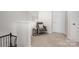 Cozy loft area featuring neutral carpeting, chair and accent table at 4012 Woodsmill Rd, Fort Mill, SC 29707